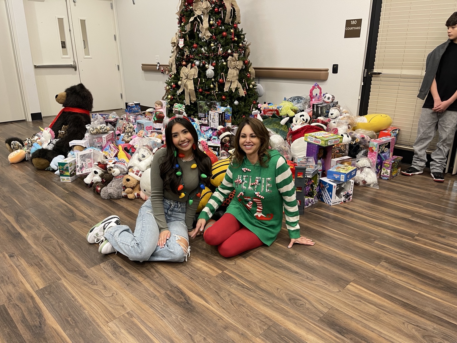 Aiyana with donated toys and stuffed animals for the Hospice Christmas Blessing