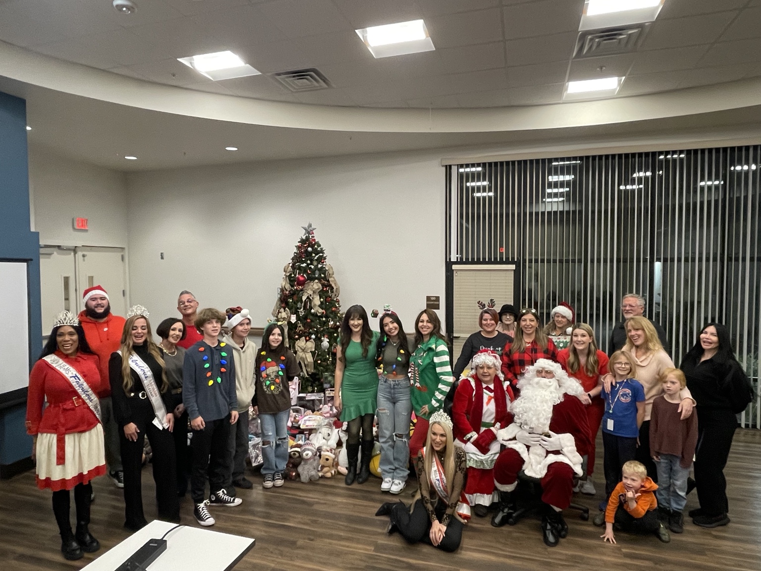 Creating a Giving Culture LV volunteers gathered with Santa and donated Christmas gifts for hospice families