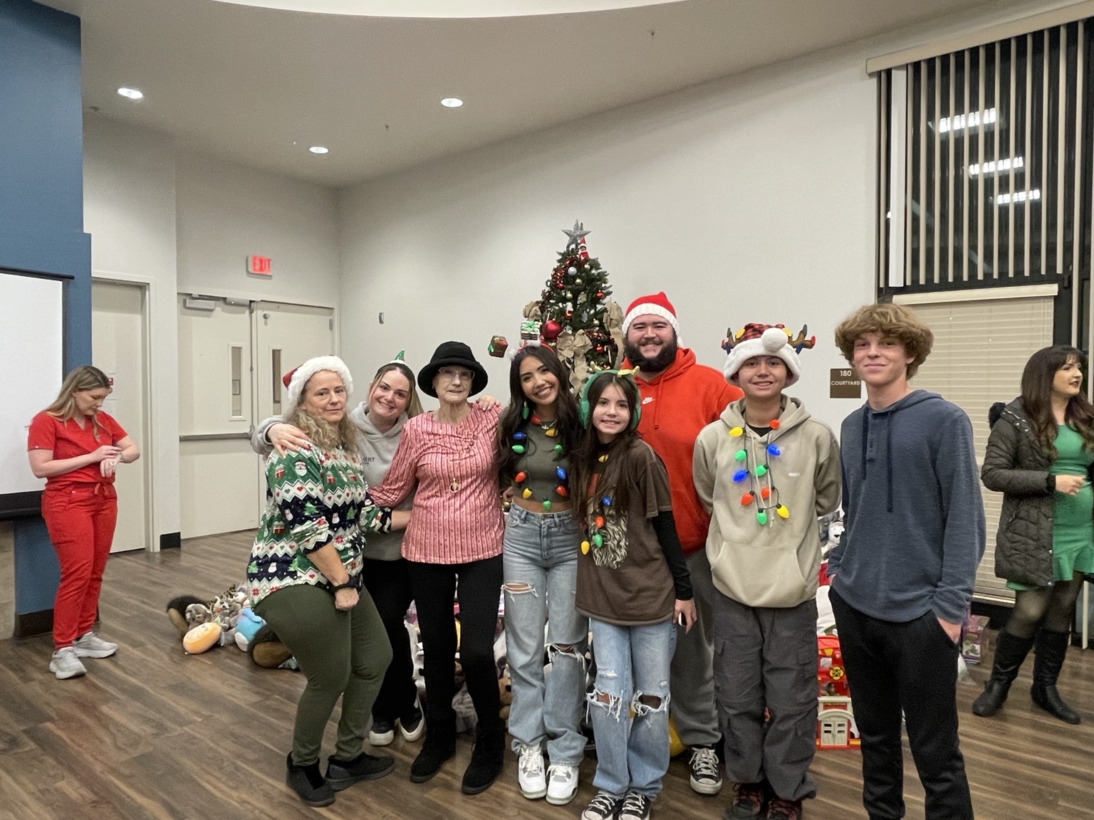 Volunteers gathered around the Christmas gift collection